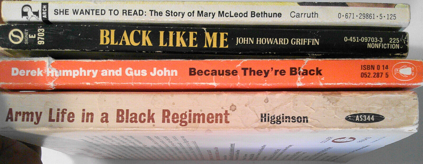 4 vintage African American history paperback books.